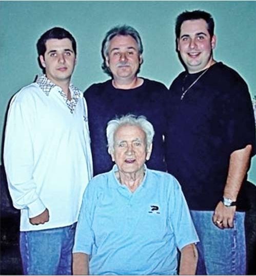 Three generations of the Brennan family: Kieran Brennan Sr. seated, with Keirn Brennan Jr. and his two sons standing behind him