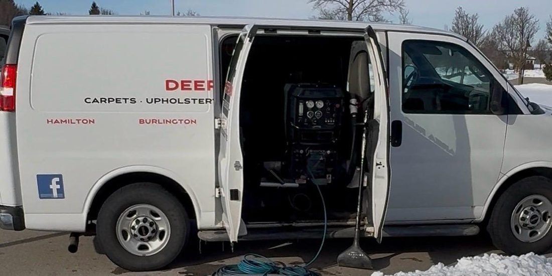 DeepSteam.ca van in winter with the side door open and the truck-mounted extraction unit visible inside